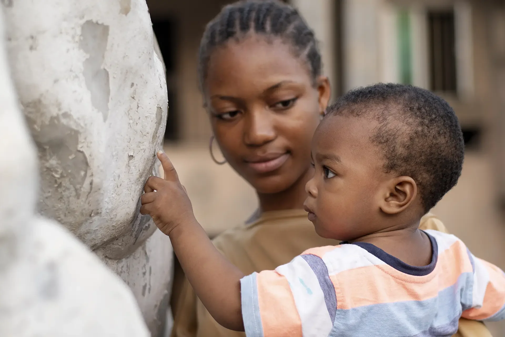 African mother and child bonding outdoors